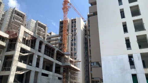 Construction building with tower cranes and people at work Stock Footage 240602629