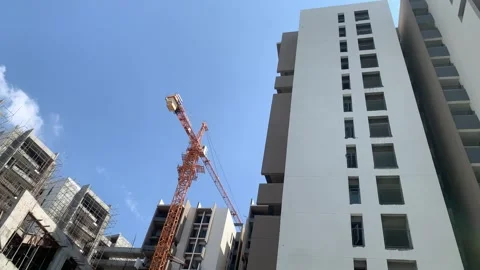 Construction building with tower cranes and people at work Stock Footage 240602656