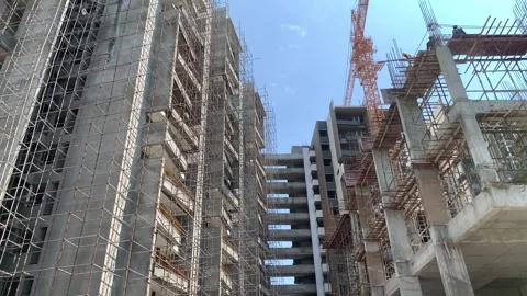 Construction building with tower cranes and people at work Stock Footage 240602851