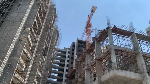 Construction building with tower cranes and people at work Stock Footage 240602960