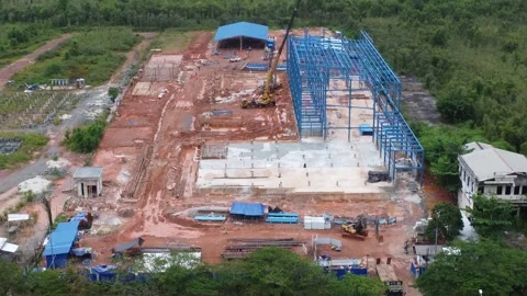 Construction of a building using iron as the frame, with cranes located aro.. Stock Footage 325642584