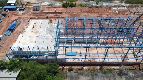 Construction of a building using iron as the frame, with cranes located aro.. Stock Footage 327996138