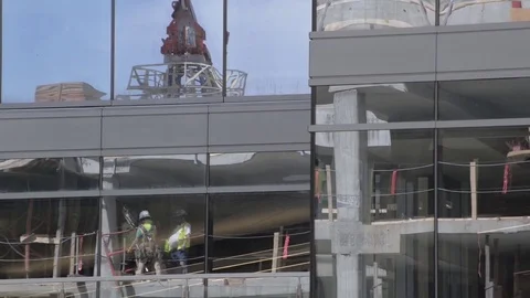 Construction building window reflections with 3 workers Stock Footage 81227729