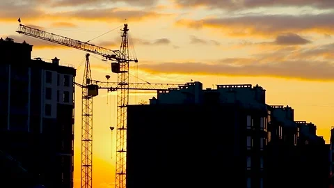 Construction Buildings and Cranes. Building Under Construction in the Evening Stock Footage 246544951