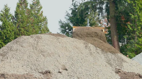 Construction Bulldozer moving rocks up hill Video stock 31383487