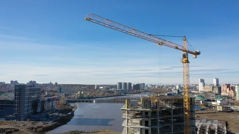 Construction of a business center, in the frame of a crane Video stock 118514636