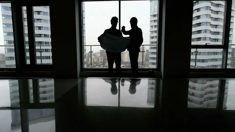 Construction business: two mans with blueprint Stock Footage 87770690