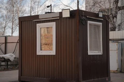 Construction cabin made of a shipping container at the construction site Stock Photos