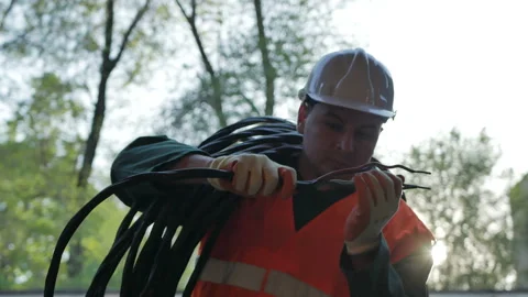 Construction cable worker helmet on checking coil of wires Stock Footage 89230672