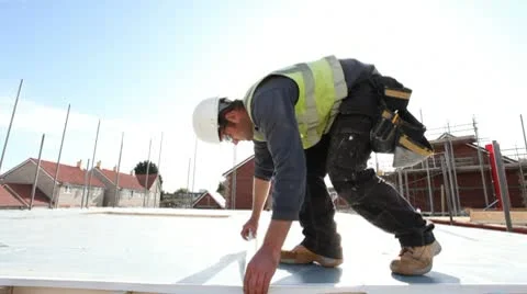 Construction. Carpenter working on construction site. Video stock 8996273