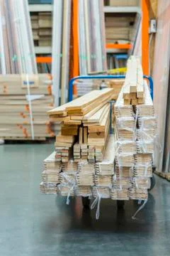 Construction cart in the building store. Carts loaded with boards. shop of bu Fotos de archivo