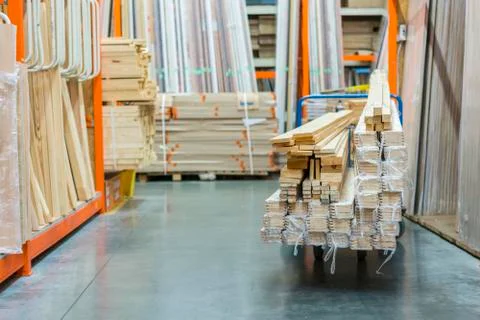 Construction cart in the building store. Carts loaded with boards. shop of bu Fotos de archivo