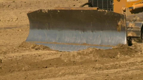 Construction, caterpillar scraper, follow shot on blade Stock Footage