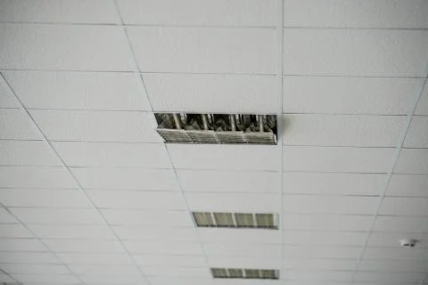 The construction of the ceiling, a broken Ceiling lamp Stock Photos