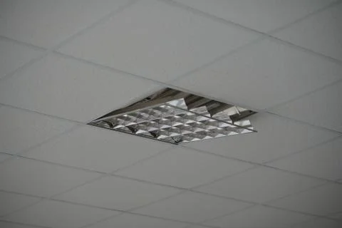 The construction of the ceiling, a broken Ceiling lamp Stock Photos