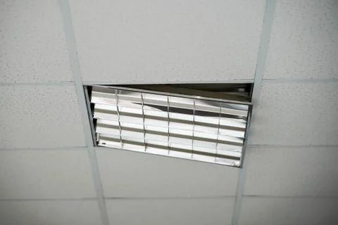 The construction of the ceiling, a broken Ceiling lamp Stock Photos