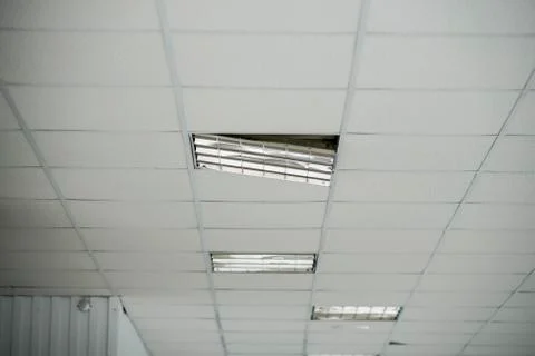 The construction of the ceiling, a broken Ceiling lamp Stock Photos