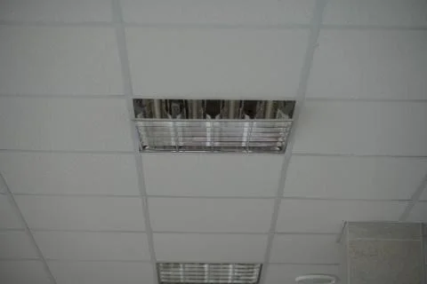 The construction of the ceiling, a broken Ceiling lamp Stock Photos