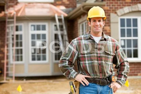 Construction: cheerful worker on construction site Stock Photos