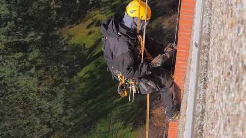 Construction climber working on hieght. Work with increased risk Vídeos de archivo 96562839