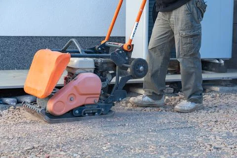 Construction compactor in use Фото