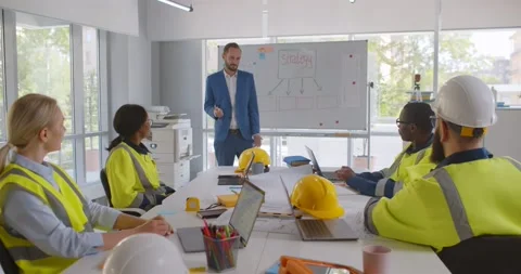 Construction company executive presenting new project to architect team Stock Footage 156183294