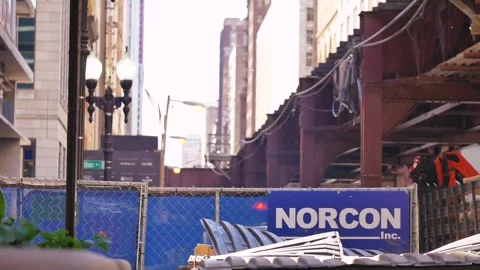 Construction company logo on a chain link fence Stock Footage 273711360