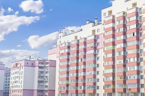Construction complex high rise pink residental apartment buildings with many Stock Photos
