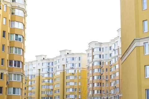Construction complex with high rise yellow residental apartment buildings w.. Stock Photos