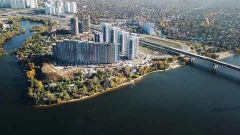 Construction of a complex of multi-apartment houses on the river bank. Many Stock Footage 81701365