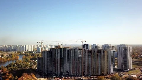 Construction of a complex of multi-apartment houses on the river bank. Many Stock Footage 84676725