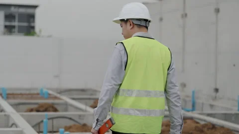 Construction concept of 4k resolution. Asian male engineer inspects buildin.. Vidéo 329189838