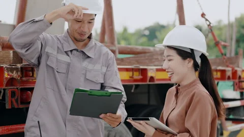 Construction concept of 4k resolution. Engineers are discussing building a .. Stock Footage 312700324