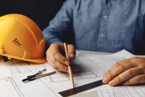 Construction concept. Architect working on blueprint Stock Photos