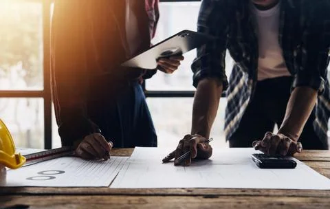 Construction concept of Engineer and Architect working at Construction Site.. Stock Photos