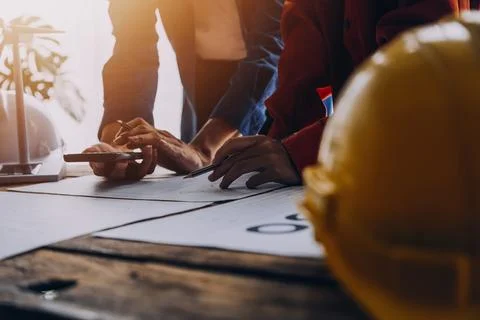 Construction concept of Engineer and Architect working at Construction Site.. Stock Photos