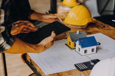 Construction concept of Engineer and Architect working at Construction Site.. Stock Photos