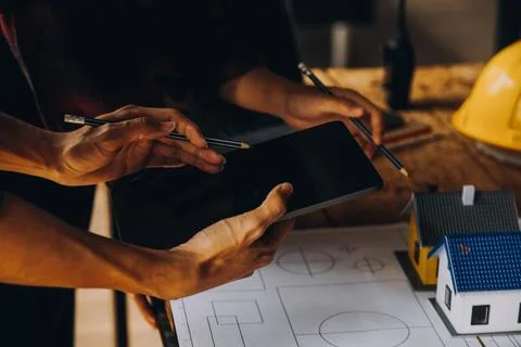 Construction concept of Engineer and Architect working at Construction Site.. Stock Photos