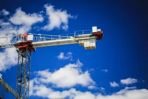 Construction concept. A new building under construction against the sky. Blue Stock Photos