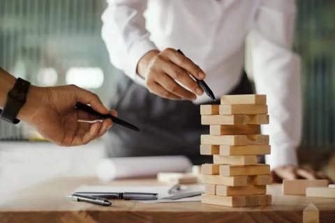 Construction Concept. Team work. Architectural project engineers and blueprint Stock-Fotos