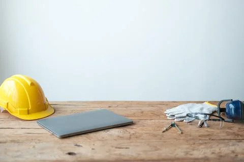 Construction concepts. White safety helmets blueprints on the engineering desks Stock Photos