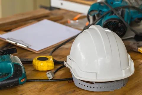Construction concepts. White safety helmets blueprints on the engineering d.. Foto stock
