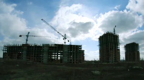 Construction of concrete buildings on background moving clouds Stock Footage 37133837