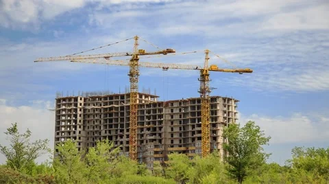 Construction of concrete buildings on background moving clouds Stock Footage 52908099