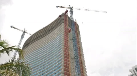 Construction of concrete buildings on background moving clouds in Miami Beach Stock Footage 63279140