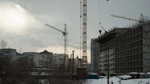 Construction of concrete buildings on background moving clouds Stock Footage 72709248