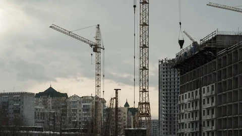 Construction of concrete buildings on background moving clouds Stock Footage 72709453