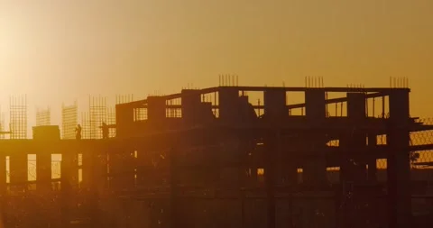 Construction of a concrete house in the sunset Stock Footage 227005830