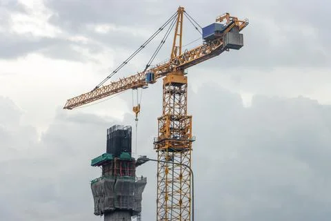 Construction of a concrete pillar using a high-rise crane Stock Photos