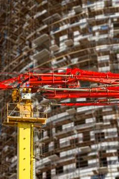 Construction concrete pump with multi-storey building under construction Stock Photos